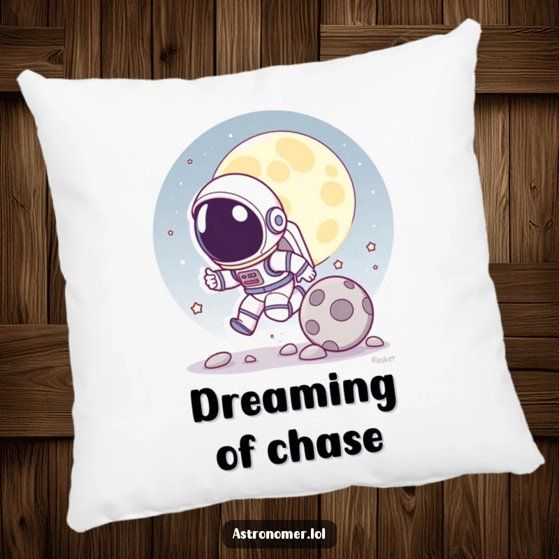 Funny pillow featuring a cartoon astronaut playfully chasing a rolling moon rock, perfect for comfortable and humorous decor.