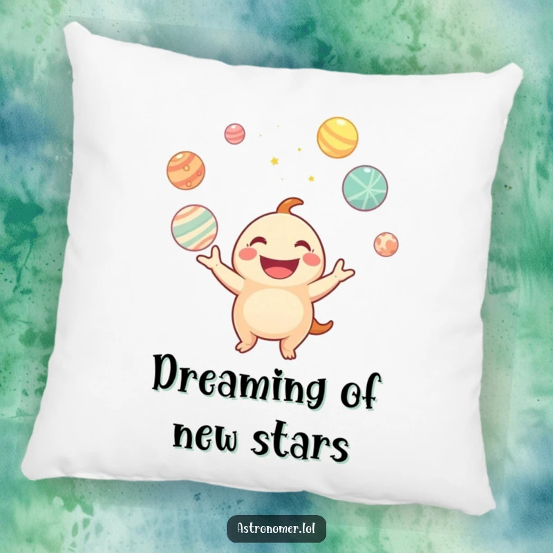 Funny pillow displaying a creature with a wide smile juggling glowing planets, adding comfort and cosmic humor to any setting.