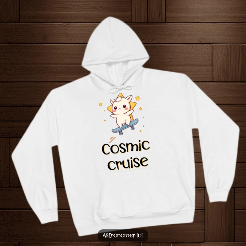 Funny hoodie depicting a whimsical creature confidently riding a shooting star as a skateboard, radiating excitement.
