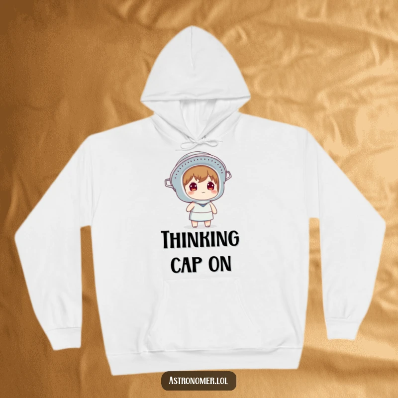 Funny hoodie depicting a character wearing a colander as a helmet while looking up at the sky, offering warmth and contemplation.