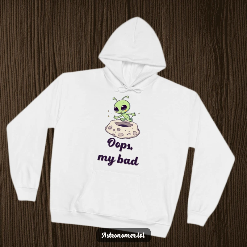 Funny Hoodie: A goofy alien character comically tripping while navigating a moon crater.
