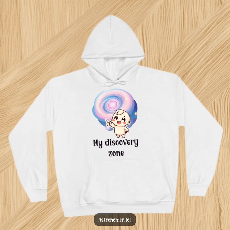 Funny hoodie showing an ecstatic character pointing at a mesmerizing swirling galaxy, perfect for cozy cosmic exploration.