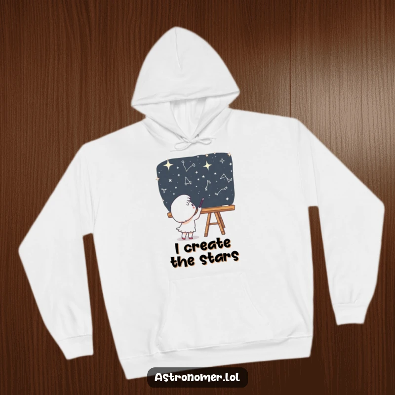Funny Hoodie: A cute character is engrossed in drawing constellations on a chalkboard, set in the deepness of space.