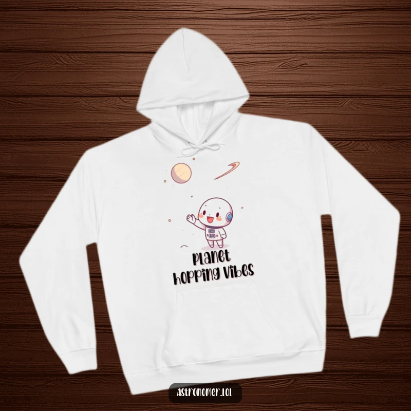 Funny Hoodie featuring a character enthusiastically waving a hand at a small, distant planet in outer space.