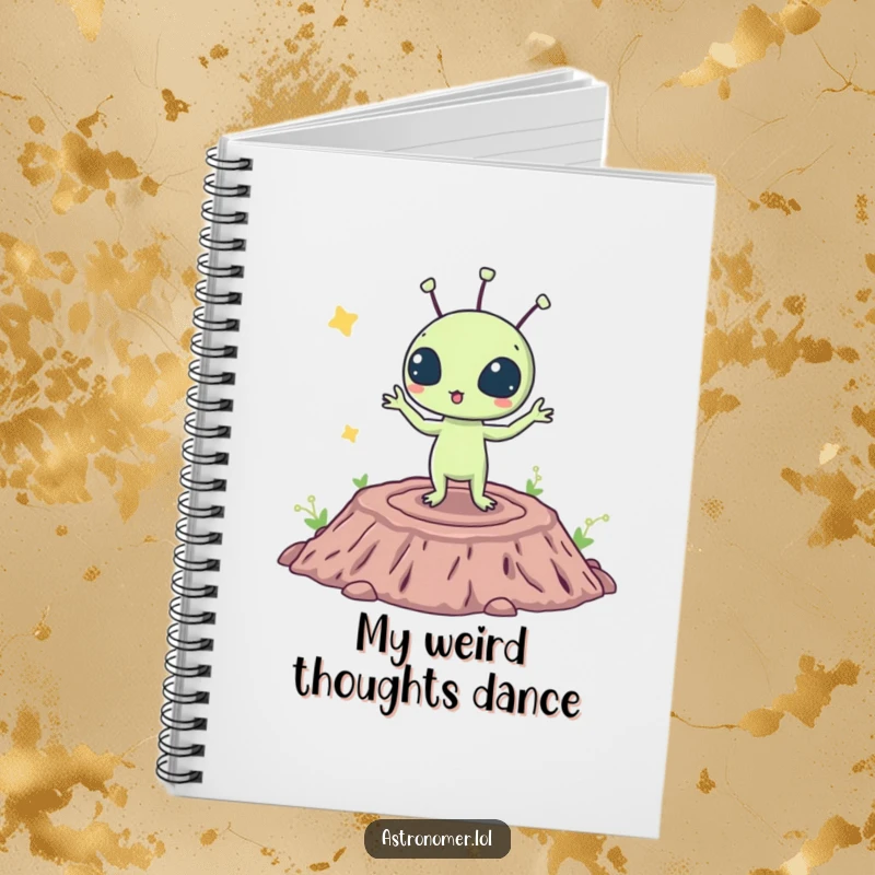Funny notebook cover featuring a surprised alien doing a silly dance on a crater, ideal for jotting down humorous ideas.