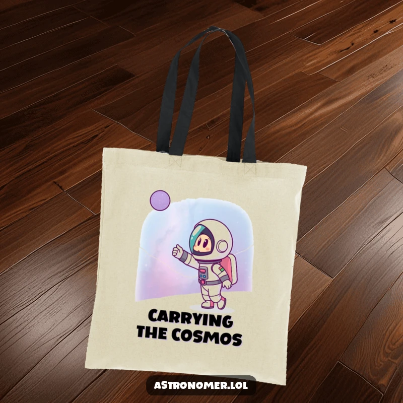 Funny tote bag depicting a cartoon astronaut excitedly pointing towards a distant galaxy, ideal for carrying everyday essentials with style.