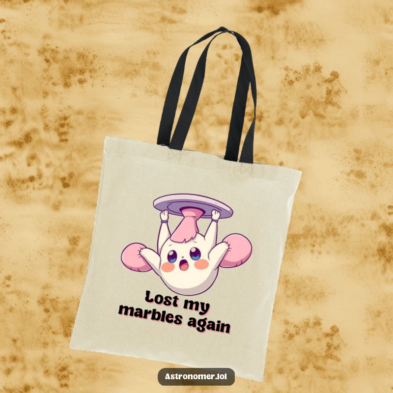Funny tote bag illustrating a dazed creature floating upside down in zero gravity, perfect for carrying items with a humorous, spacey vibe.
